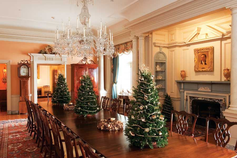 Washington, D.C., designers J.D. Ireland Interiors graced the State Department's Monroe Room conference table with mini holiday trees made from boxwood sprigs.